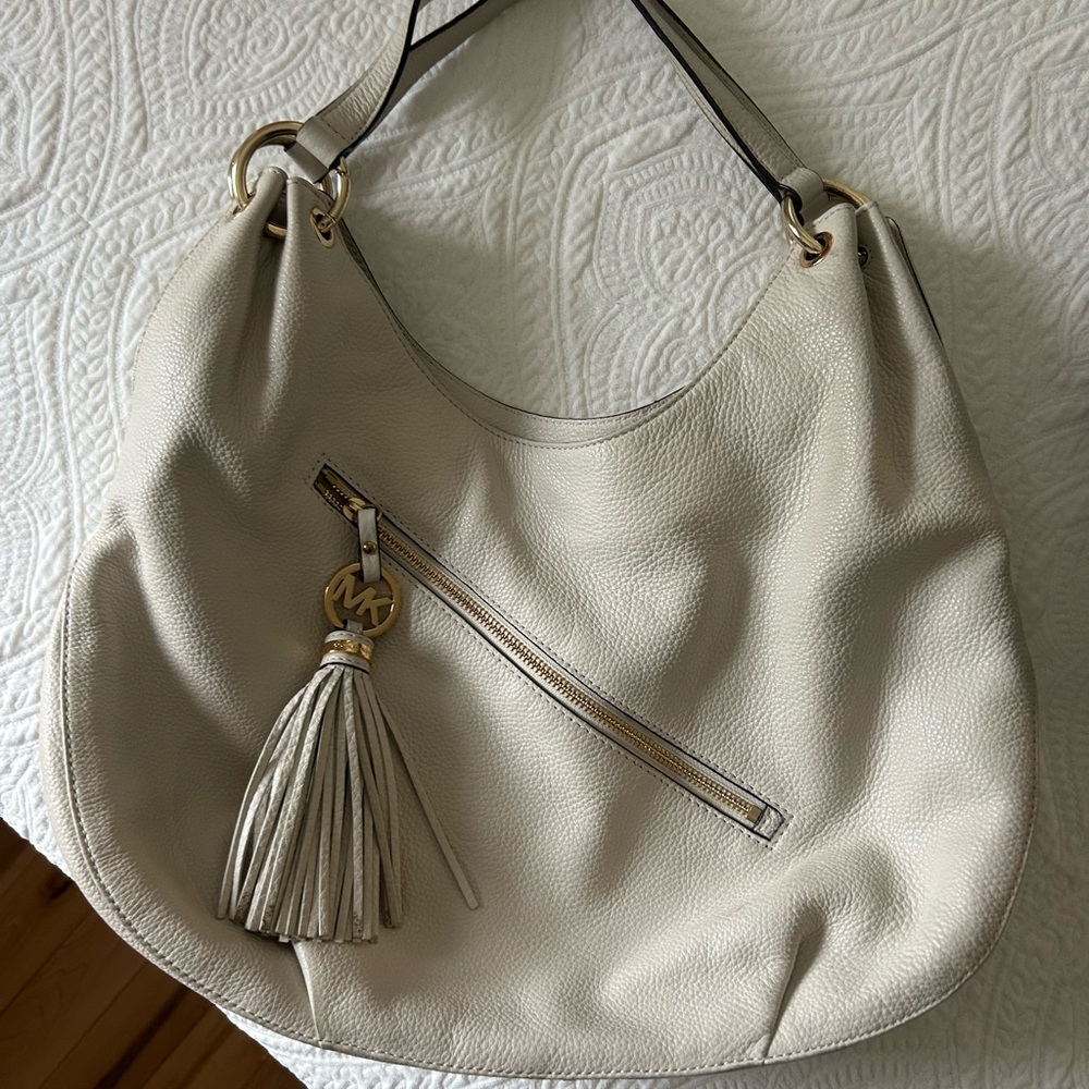 Luxurious Cream Hobo Bag with Tassel Accent